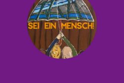 Das Bild zeigt eine Gruppe von Menschen mit unterschiedlichen Hautfarben und Haarstrukturen, die gemeinsam einen großen Regenschirm hochhalten. Auf dem Regenschirm ist die Wuppertaler Schwebebahn abgebildet, während im Hintergrund eine braune Holzstruktur zu sehen ist; darüber steht in gelber Schrift 'SEI EIN MENSCH!'.