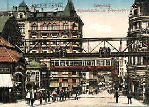 Die kolorierte Postkarte zeigt den Übergang Brausenwerther Platz / Alte Freiheit mit dem Schwebebahnhof (links) vor 1914