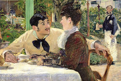 Bild mit zwei Personen an einem Tisch