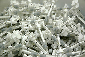 Verbrauchte Spritzen einer Grippeschutzimpfung